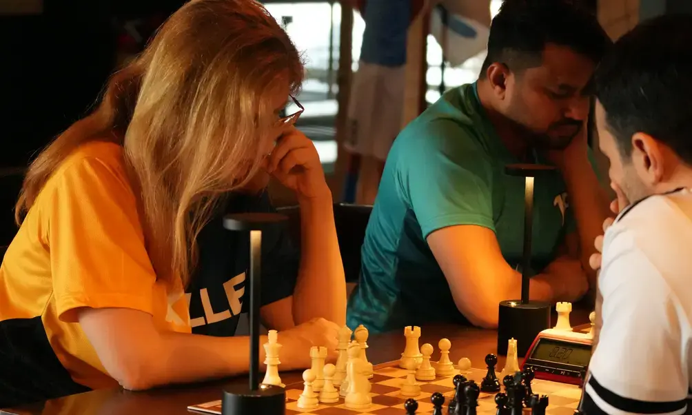 Keller team member playing chess