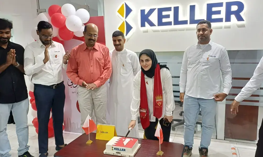 Cutting cake to celebrate Bahrain's National Day