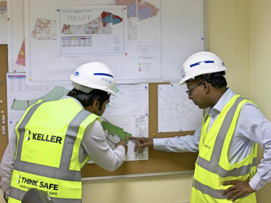 Keller engineers studying a site plan