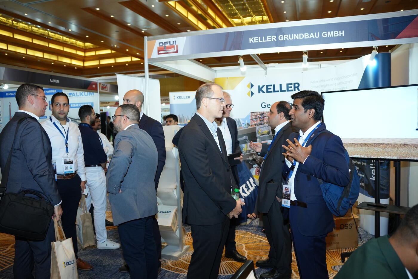 Visitors gathered around at Keller stand at DFUI Mena Conference