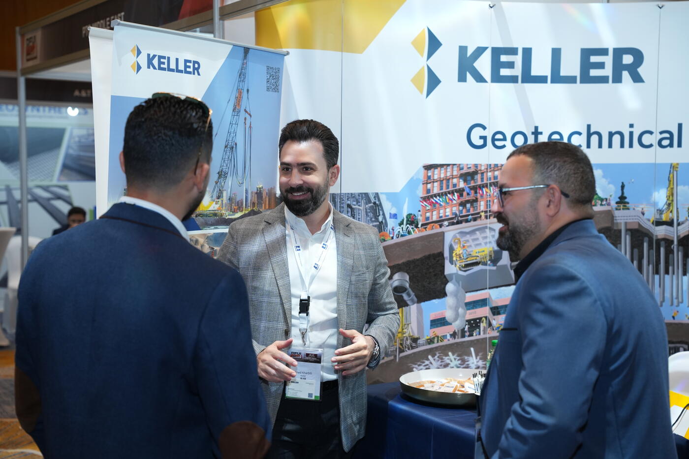  team liaising with visitor at Keller's stand at DFUI Mena 