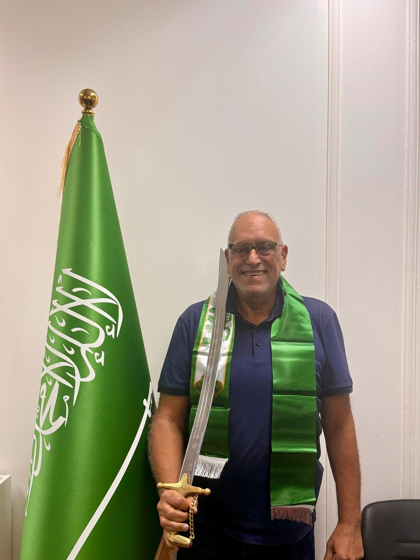 Keller employee alongside Saudi flag