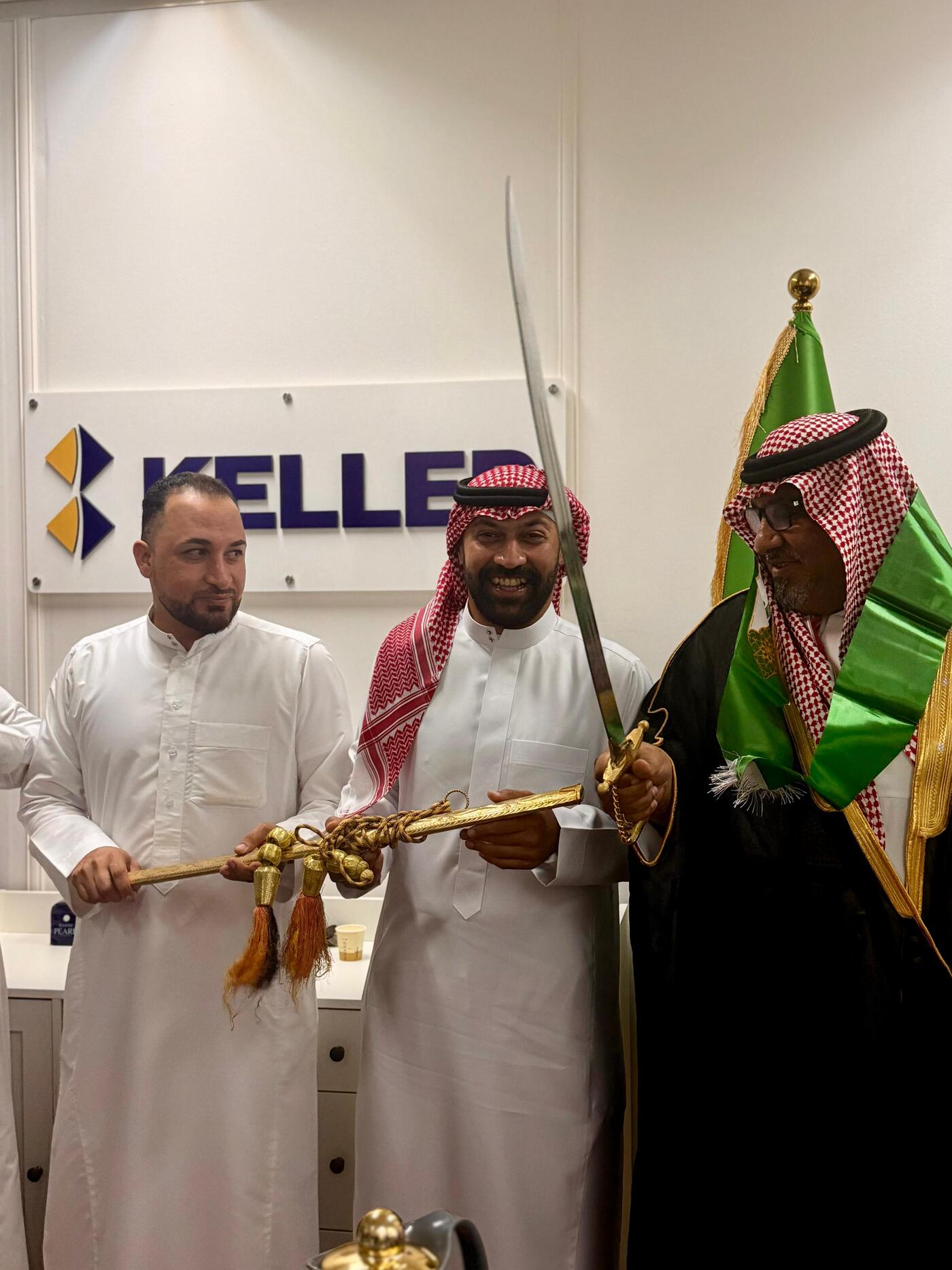 Celebrating Saudi Arabia's national day in traditional attire and ornamental sword