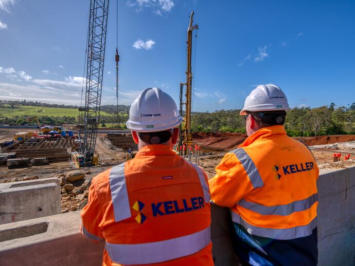 Two Keller employees observing a construction site
